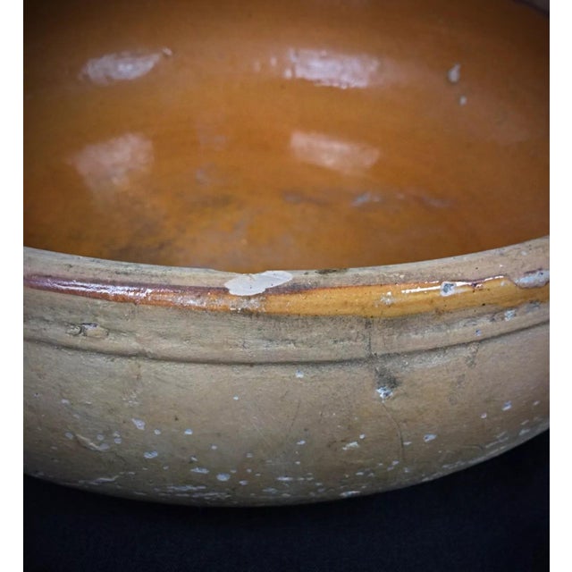 This large antique terracotta pan, signed by La Bourguignonne, is a remarkable piece of vintage kitchenware that combines...