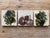 Charming set of three decorative travertine stone coasters featuring classic Mediterranean-inspired imagery of olives,...