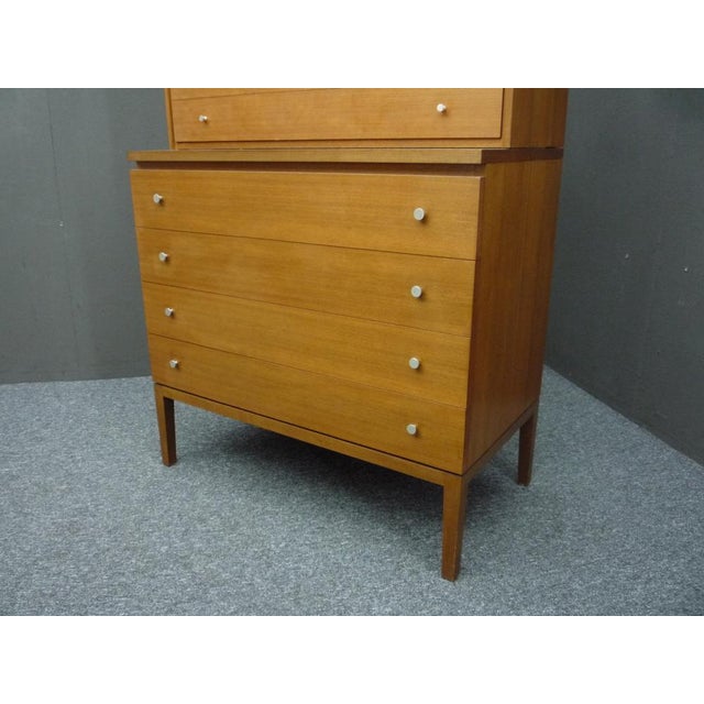 Rare highboard by Paul McCobb. High quality manufactured by WK Möbel. Veneered with walnut and equipped with stainless...