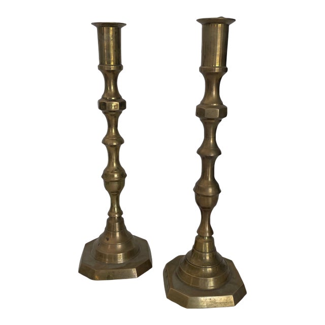 A Pair of Antique Brass Candlesticks For Sale