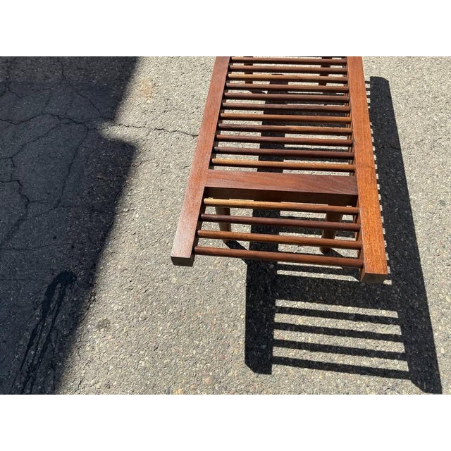 Mid century solid walnut bench in manner of Milo Baughman for Glenn of California. The bench is in excellent condition....