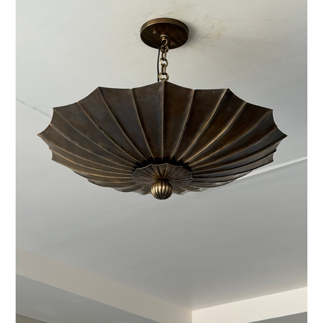 Bring timeless elegance and architectural character to your home with this handmade antique brass pendant light fixture....