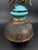 Signed studio pottery lidded vessel by American ceramic artist George Whitten. The piece features a raku-fired surface...