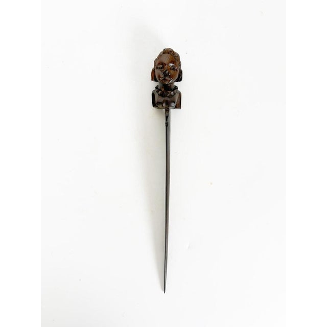 Elegant Art Deco letter opener hand-carved from dark wood, featuring a finely sculpted female bust forming the handle. The...