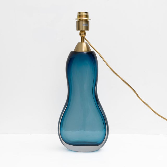 Elegant Italian table lamp in blue Murano glass, crafted using the traditional Sommerso glass technique. The body features...