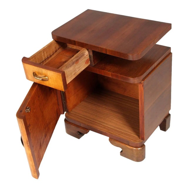 This Art Deco bedside table in burl elm and rosewood was made in 1920s in the style of Gaetano Borsani. This piece has an...