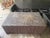 A showstopping coffee table built entirely from solid peeled logs in a Kahlua finish, topped with a dense end-grain “log...