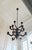 Paul Ferrante Style. Large Two-Tier French Provincial 12 Light Wooden Chandelier with a turned baluster center column and...