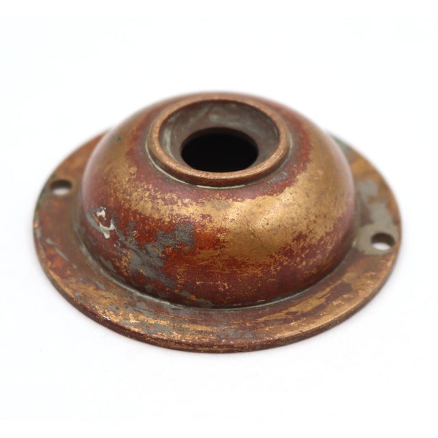 Vintage circular doorbell cover made of brass with a patina finish. The original mounting screws are not available. Good...