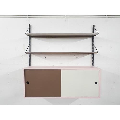 About this item Tjerk Reijenga for Pilastro wall-unit. The shelves and cabinet have been repainted in beige, taupe, white...