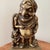 A wonderful bronze doorstop or door porter in the form of Mr. Punch dressed as a Roman emperor. A cartoon of Punch in...