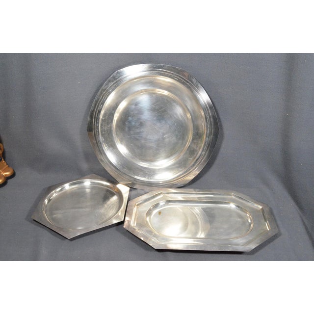 France, 20th Century A handsome assembled collection of three vintage French silver-plated serving platters, combining...