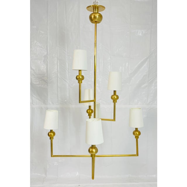 Elegant and architecturally refined, the “Comtesse Offset Chandelier” by Paloma Contreras for the Visual Comfort Signature...