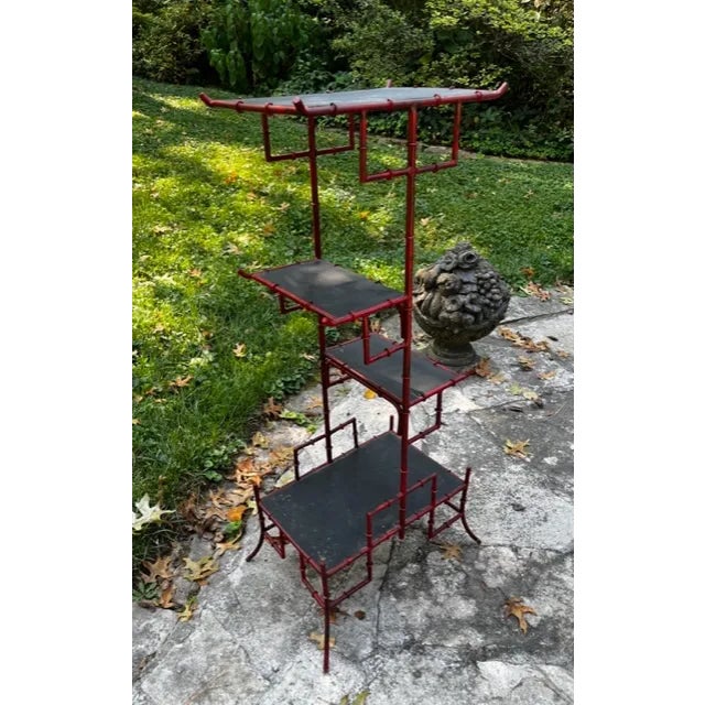 Red Faux Bamboo Display Etagere Made of Metal and With a Distressed Red Finish. This Etagere shelf or display stand has...