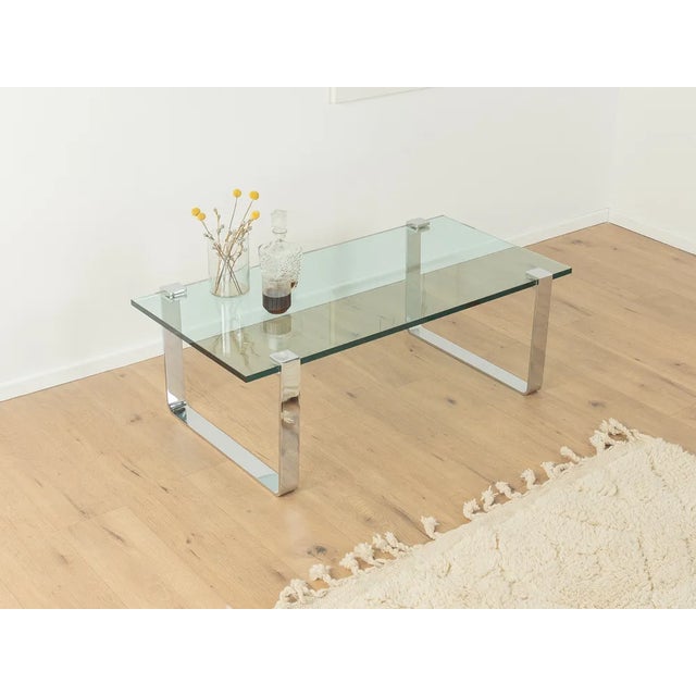 Rare coffee table K 831 by Friedrich Wilhelm Möller for Ronald Schmitt from the 1970s. 19mm thick glass top with high-...