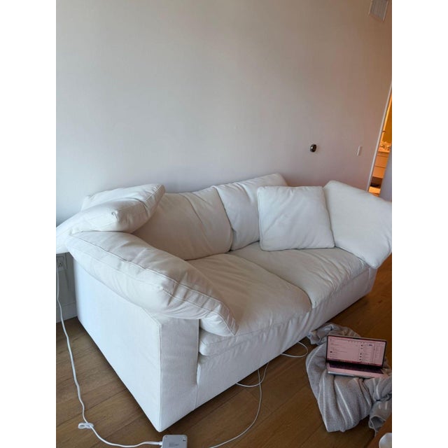 This Restoration Hardware 3-seat sofa offers a spacious and comfortable seating area with plush cushions and a clean,...