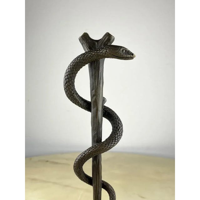 Bronze and marble staff of Aesculapius, France, 1990s. This is an ancient Greek symbol associated with medicine. It...