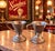 Step back into the golden age of soda fountains with this charming pair of antique Vortex Sanitary Service metal sundae...