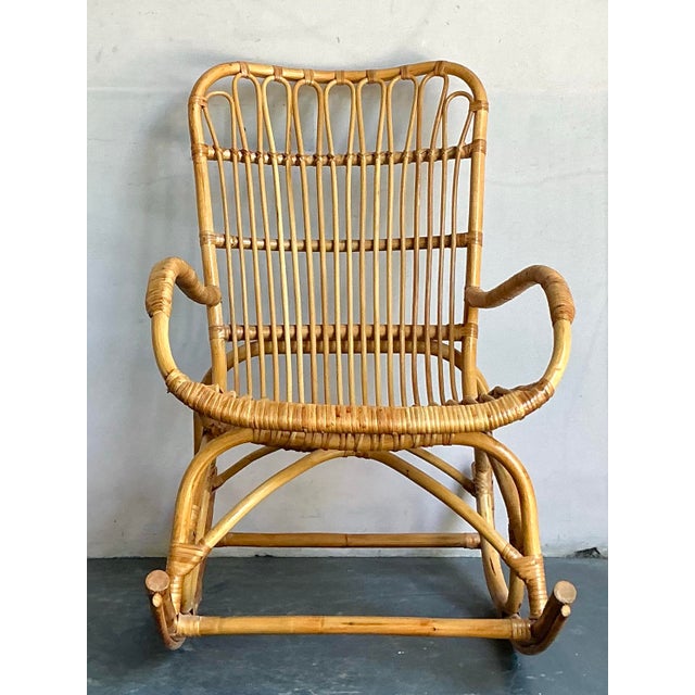 Embrace the laid-back elegance of the Mid-Century Modern era with this charming vintage rocking chair. Crafted from...