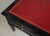 Vintage Ebonized French Bureau Plat Faux-Partner Desk with Tooled Red Leather Top and Tapered Legs on Brass Sabots.