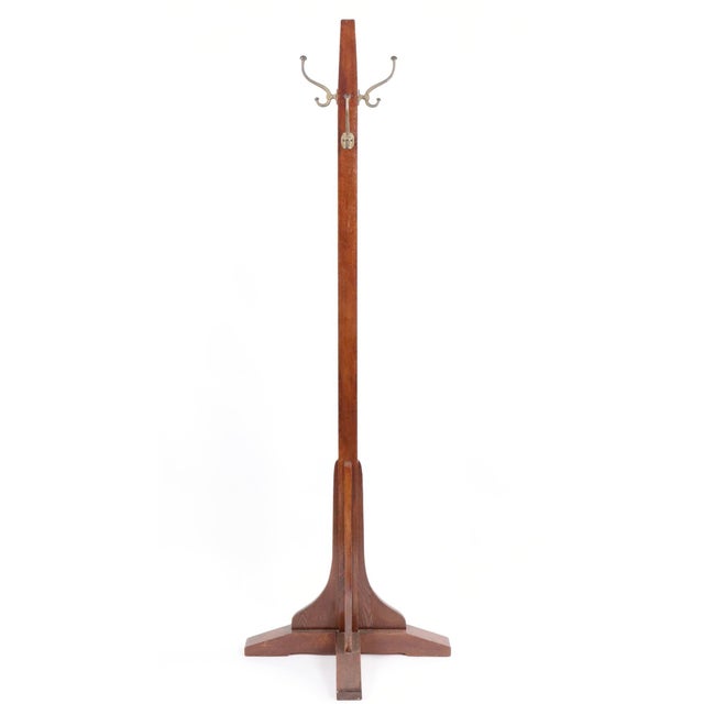 Vintage Arts & Crafts oak coat tree with four double iron hooks. Four-leg splayed base for stability, exposed joinery...