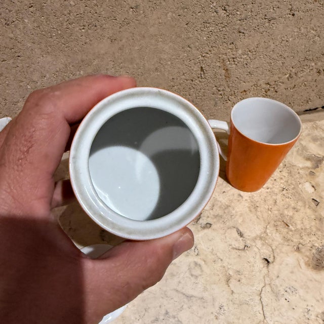 For your consideration a mid-century modern orange sugar creamer set. Coffee mug. Unmarked. Dimensions: Sugar 4 H x 3.38...