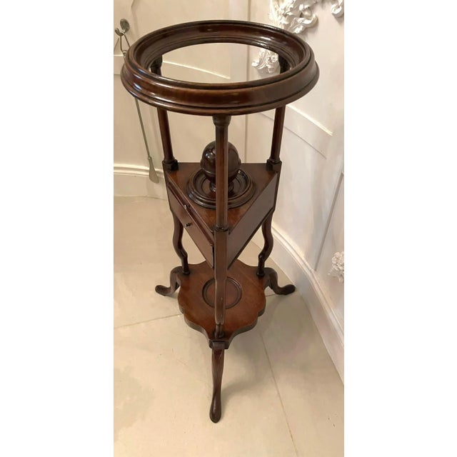 Antique george iii quality mahogany shaving stand having a quality circular top supported by three turned mahogany columns...