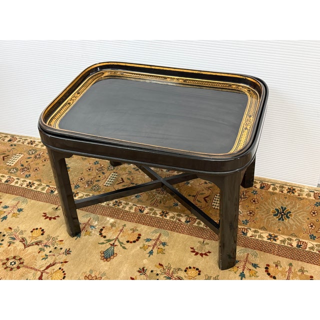 Design Plus Gallery presents a 19th century Tray Table of Black Lacquer with Golden Border from England. This exquisite...