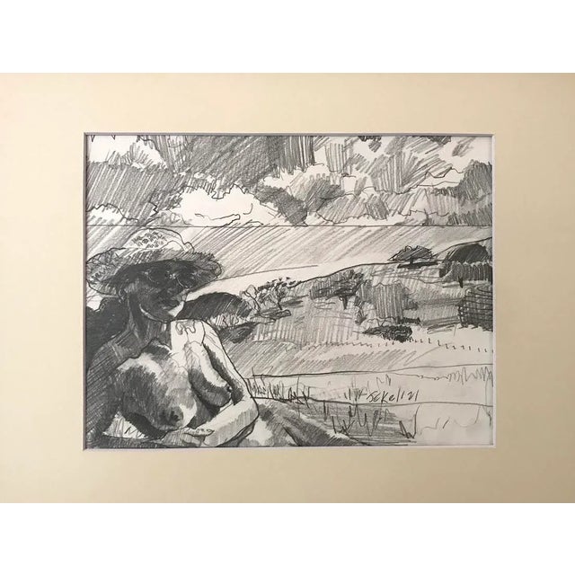 An original drawing of a Nude female in a landscape pencil on paper signed lower right. Presented in archival matte and...