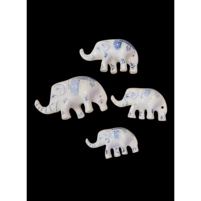 A sweet set of 4 miniature blue and white ceramic elephants. These sweet little guys are incredibly sweet. They're perfect...