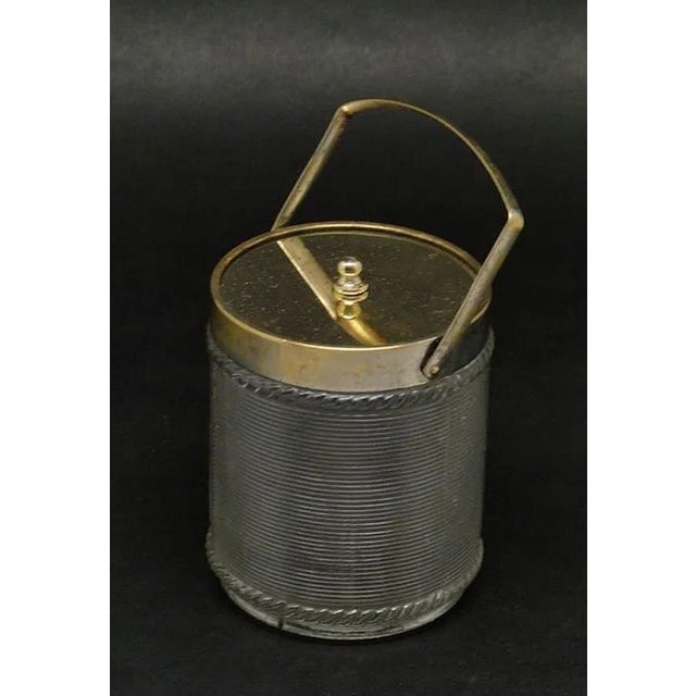 The confiturier was made of tin in Germany around 1900-1910, at the WMF factory. Her condition is good, despite the lack...