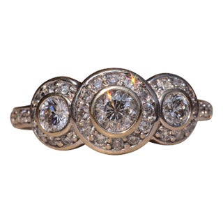 The Coast Road: Three Stone Halo Ring set with Natural Diamonds For Sale