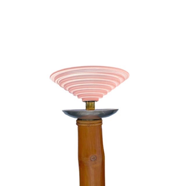 A striking French bamboo and chrome floor lamp. This stunning Art Deco era lamp has a heavy square metal base and is made...