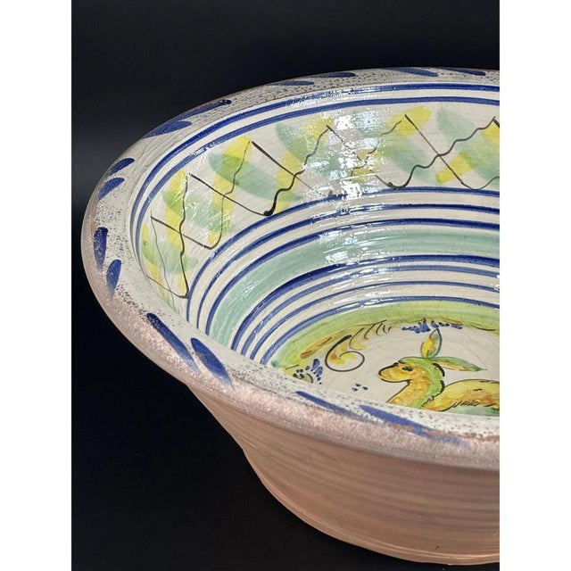 Seville potteries of Triana. Large basin with a flat base, a very open, truncated cone-shaped eaves and a thick rim from...