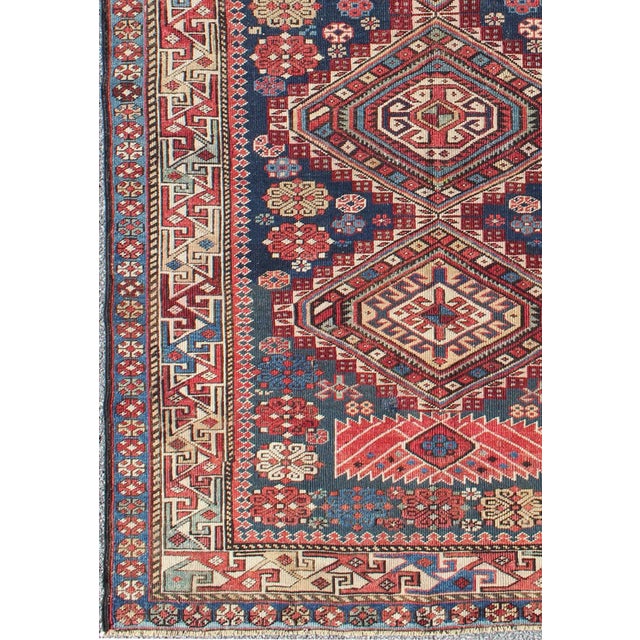 Tribal Antique Kazak Tri- Medallion Rug With Multi Coors and Indigo Background For Sale - Image 3 of 8