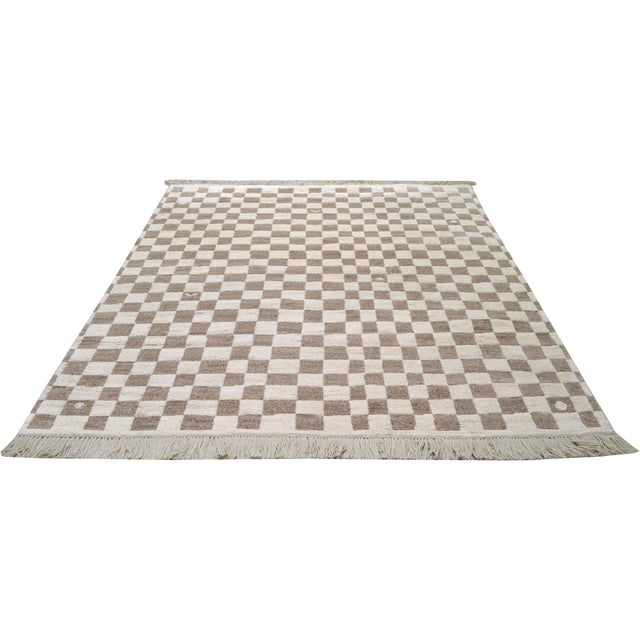 Moroccan hand knotted wool rug with checkered design, soft texture, and natural colors.