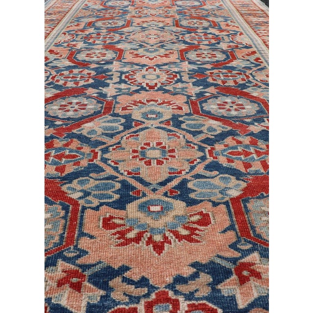 Antique Persian Tabriz Gallery rug with large scale sub geometric florals in medium blue field, red, salmon ,light blue...