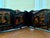 A dramatic antique Chinese Qing dynasty carved and lacquered louhan daybed, with removable paneled sides and back. The bed...