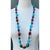 This captivating vintage turquoise and coral bead necklace presents an exceptional handcrafted composition, expertly...