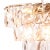 Sparkling rectangular crystals hang from different tiers, capturing and refracting light to create dramatic patterns on...