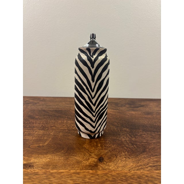 Rare 1960s Italian ceramic smoking set designed by Aldo Londi for Bitossi, featuring a coordinating table lighter and...