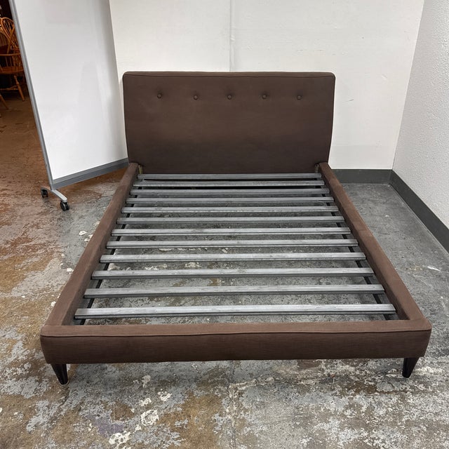 Design Plus Gallery presents a Queen Size Hoffman Bed from Room & Board. Upholstered in a dark chocolate woven fabric, the...