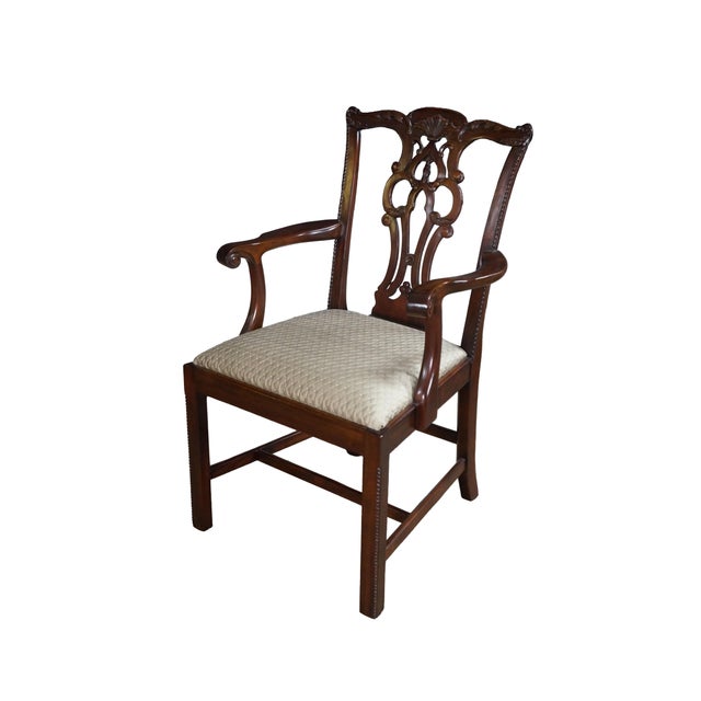 Pair of Maitland Smith Chippendale style dining armchairs, circa 1990s. Made of mahogany featuring serpentine crest rails...