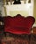 This is a Gorgeous! Antique Victorian Hand Carved Walnut Love Seat that is in Red Velvet with a Deep Tufted Back with a...