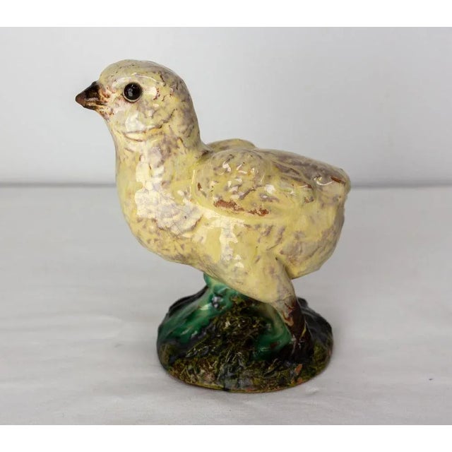 French Terracotta recovered of faience representing a chick. Signed by Joseph Filmont ceramicist in Caen, Normandy. He...