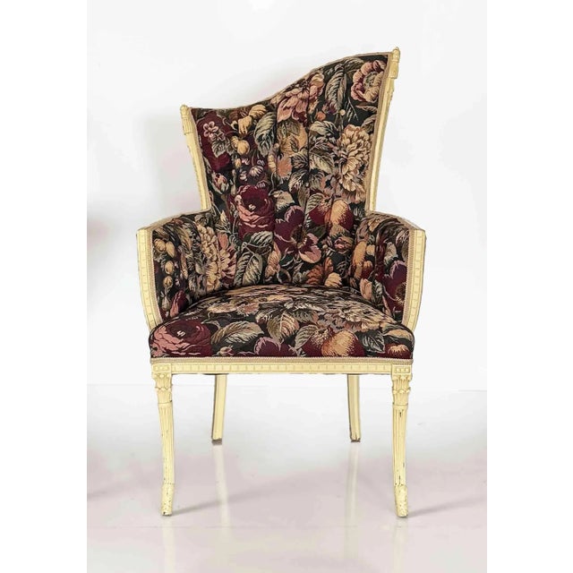 Pair of vintage, Grosfeld House asymmetrical Hollywood Regency style armchairs with a floral tapestry-style upholstery and...
