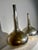 A spectacular pair of mid-century "gourd" or "bottle" shaped vases in silver-plated metal, featuring clean, organic lines....