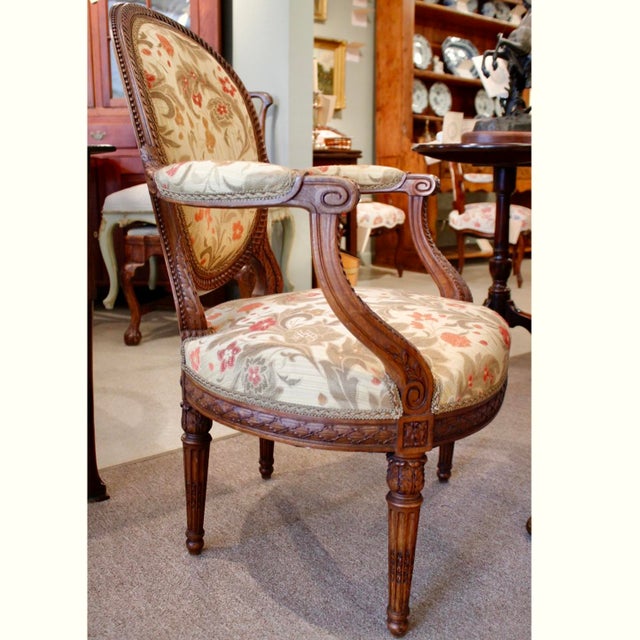 A pair of very good late 19th century French waxed beechwood fauteuils, the frames crisply carved in extremely fine detail...
