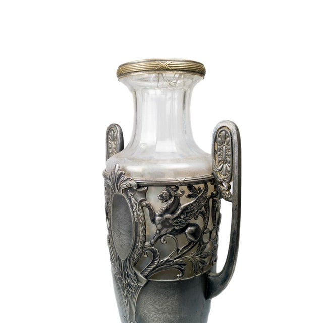 An early 20th-century German amphora vase crafted in silver-plated pewter and clear glass, designed in the Neoclassical...