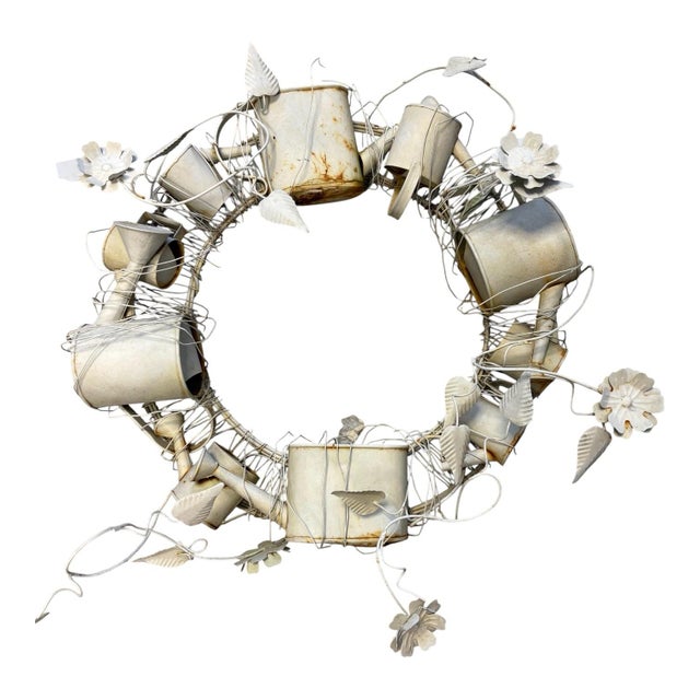 A wonderfully whimsical vintage sculptural metal garden wreath composed of miniature watering cans, flower pots, garden...